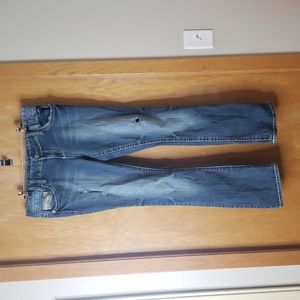 Maurice's distressed boot cut jean